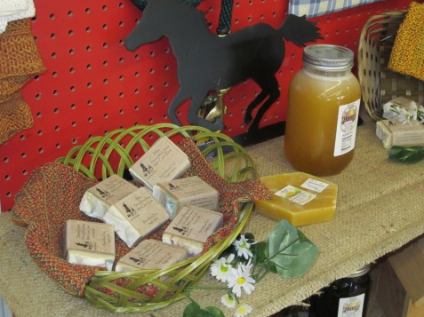 Basket of soaps beside the honey that we use for our honey wine.